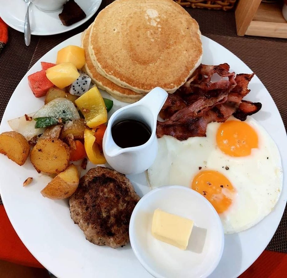 Our American Breakfast Special: eggs, bacon, sausage, home fries and pancake
