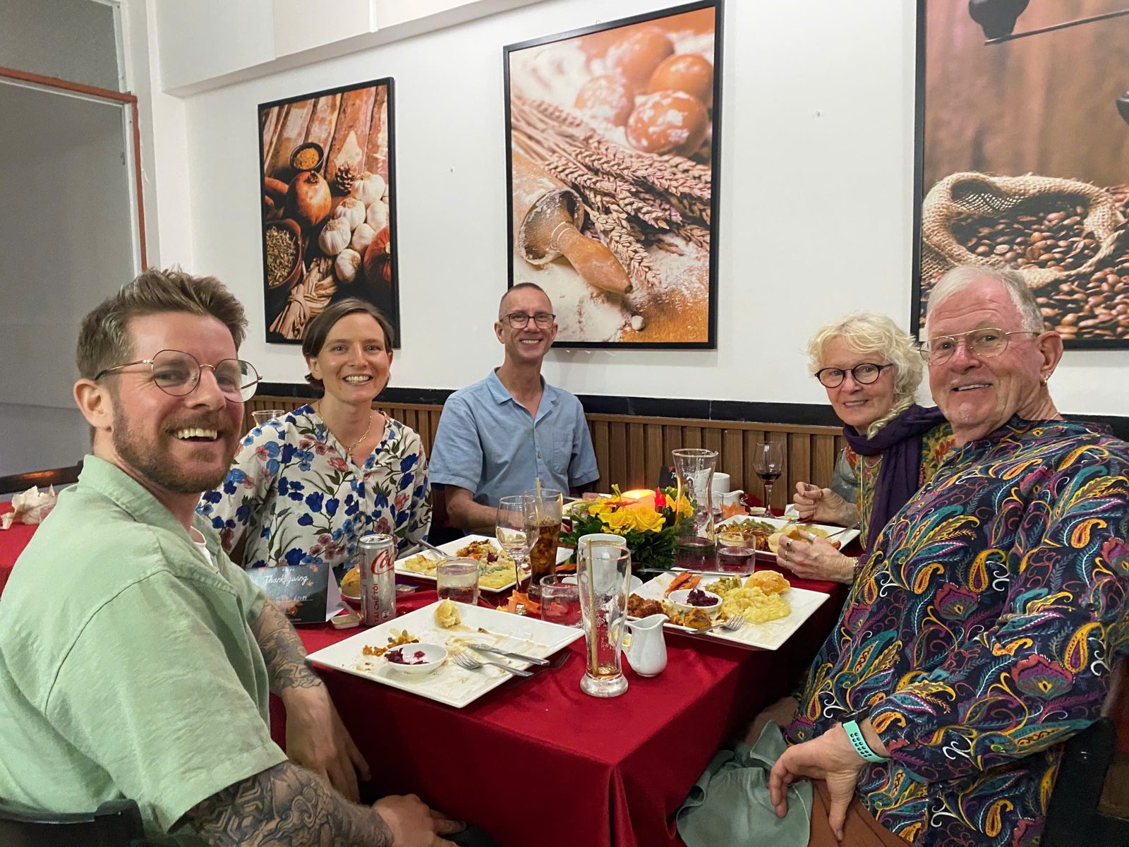 Friends sharing a meal at a long table